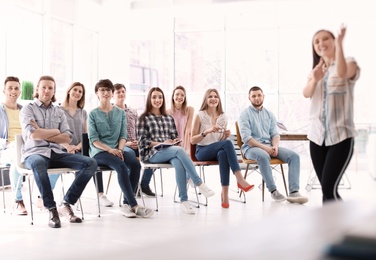 Female business trainer giving lecture in office