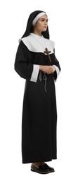 Young nun wearing cassock on white background