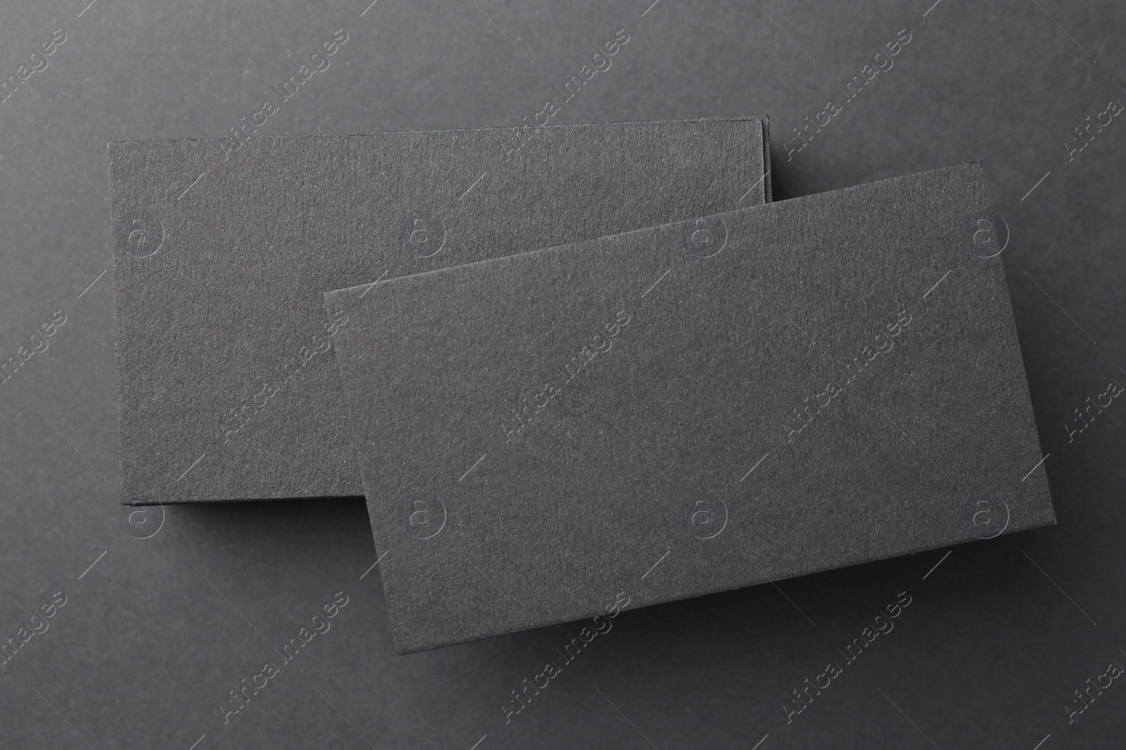 Photo of Blank business cards on black background, top view. Mockup for design