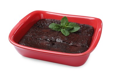 Delicious chocolate brownie in baking dish on white background