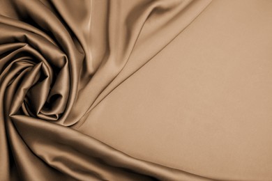 Delicate silk fabric as background, top view