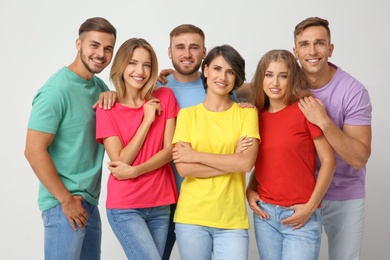 Photo of Group of young people on light background. Unity concept