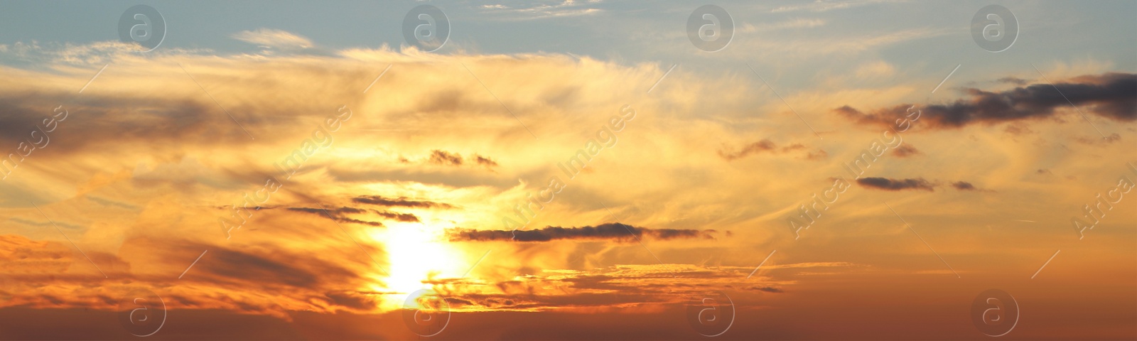 Image of Beautiful cloudy sky at sunset, banner design