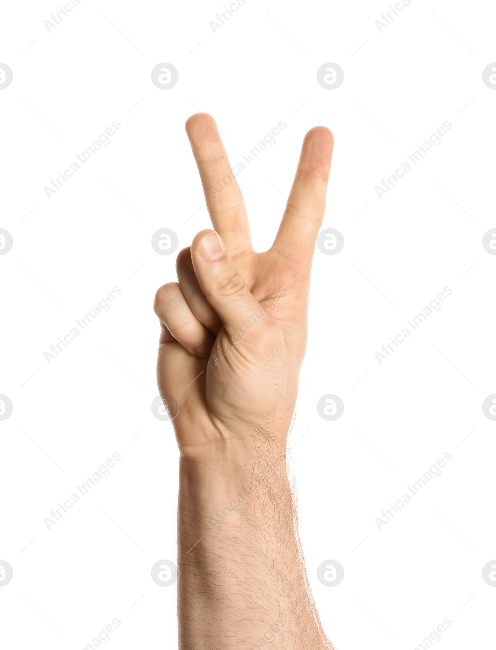 Photo of Young man showing victory gesture on white background