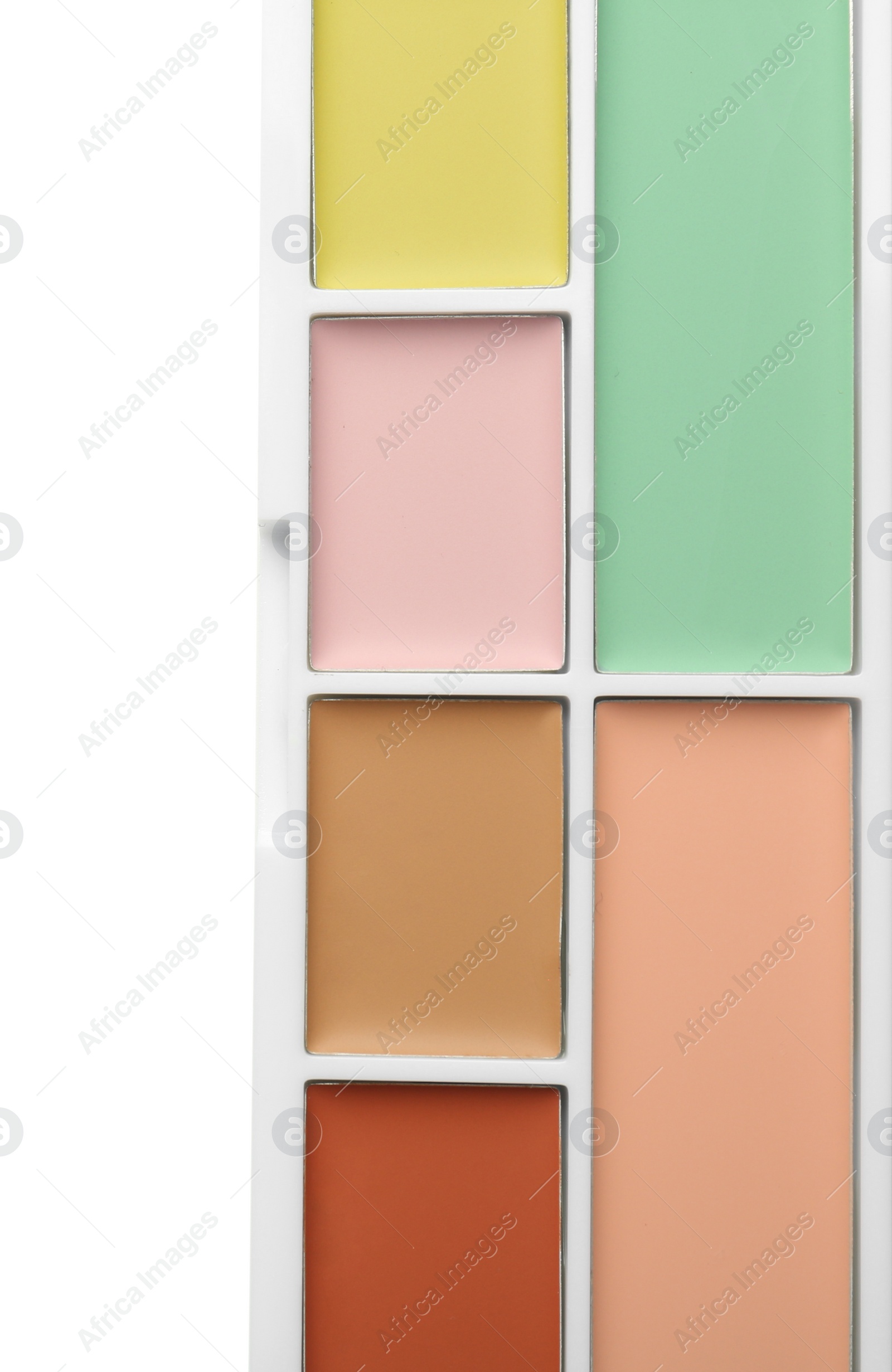 Photo of Colorful correcting concealer palette isolated on white, top view