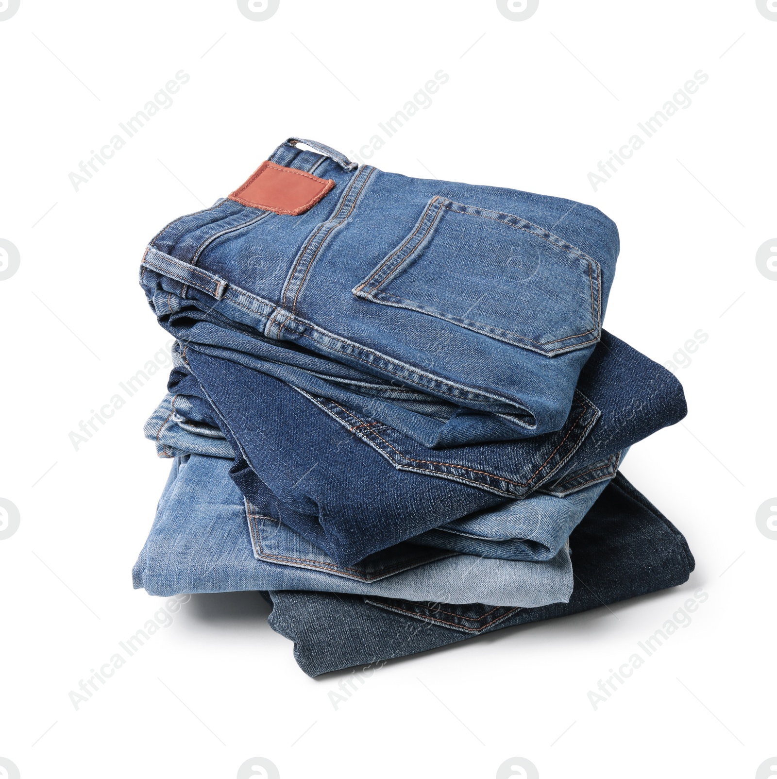 Image of Stack of different folded jeans isolated on white