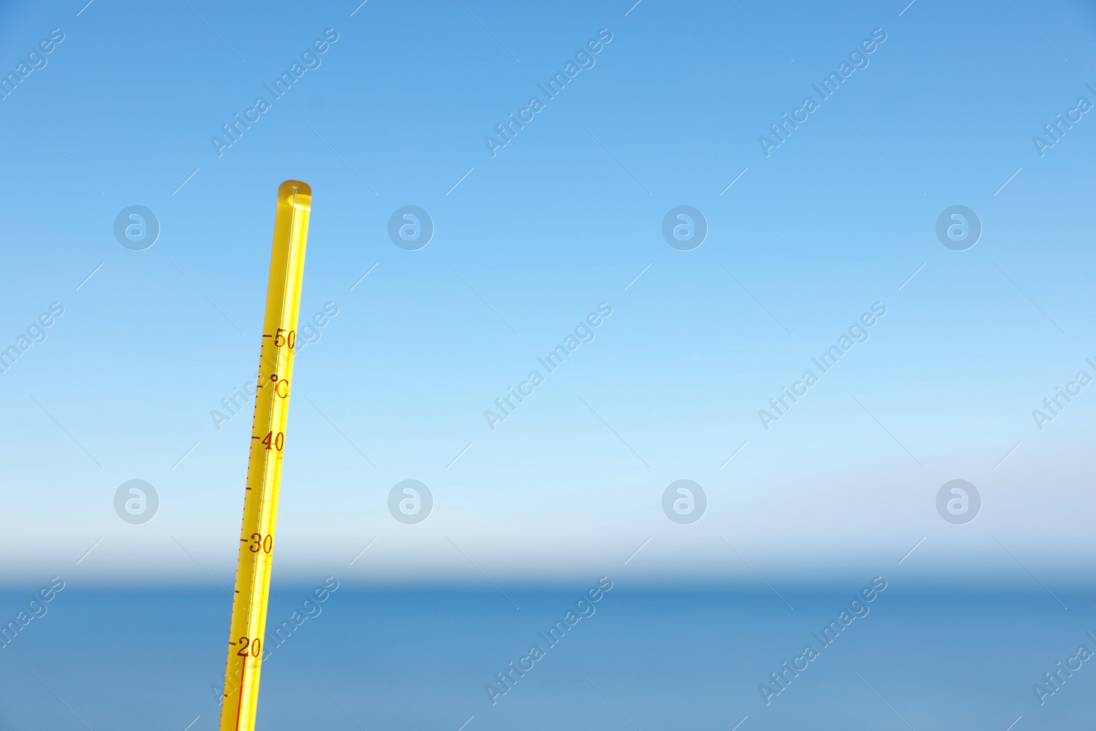 Photo of Weather thermometer at seaside, space for text