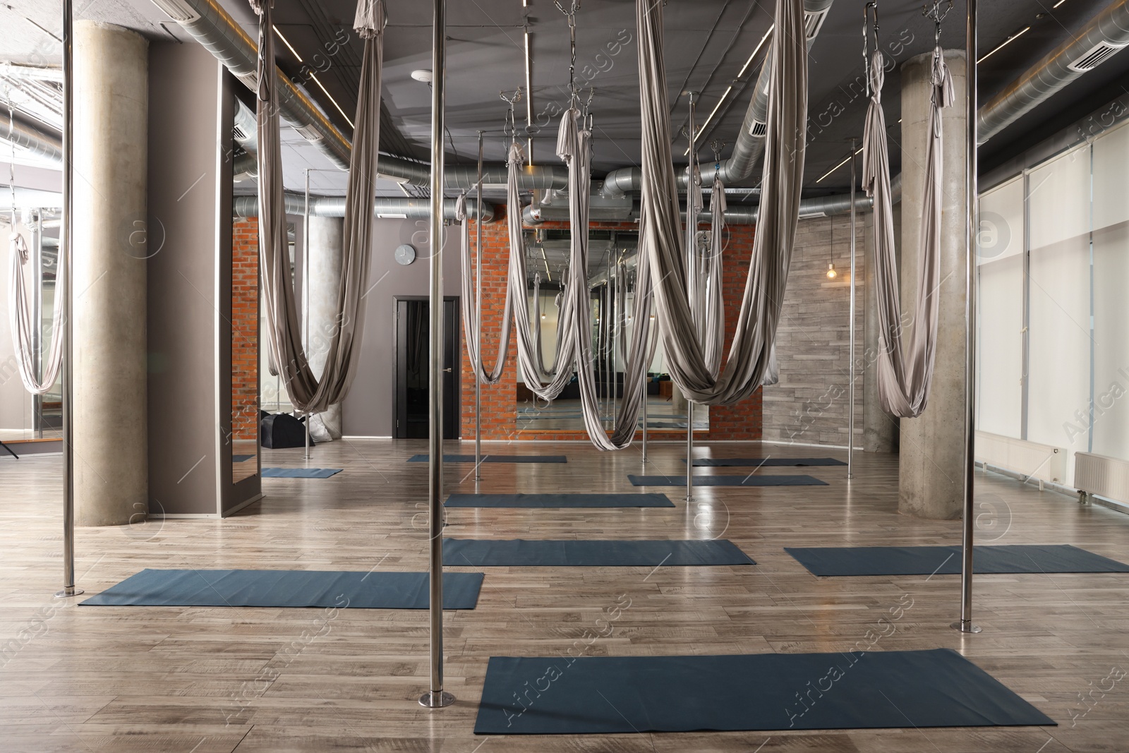 Photo of Many hammocks for fly yoga in studio