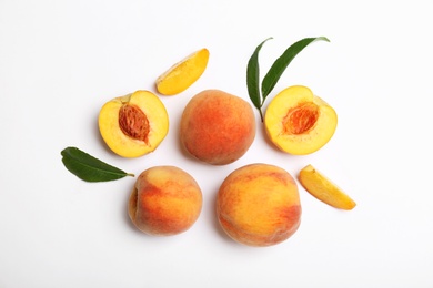 Photo of Composition with fresh sweet peaches on white background