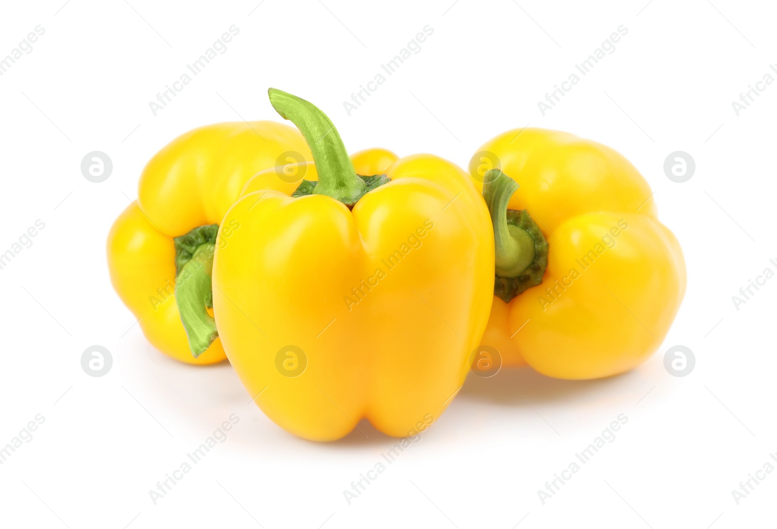 Photo of Ripe yellow bell peppers isolated on white