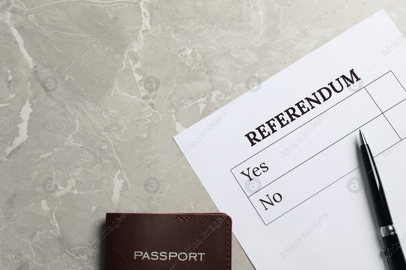 Photo of Referendum ballot with pen and passport on light grey marble table, flat lay. Space for text