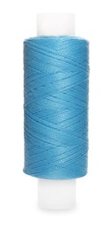 Photo of Spool of light blue sewing thread isolated on white
