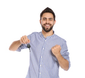 Photo of Happy young man with car key on white background. Getting driving license