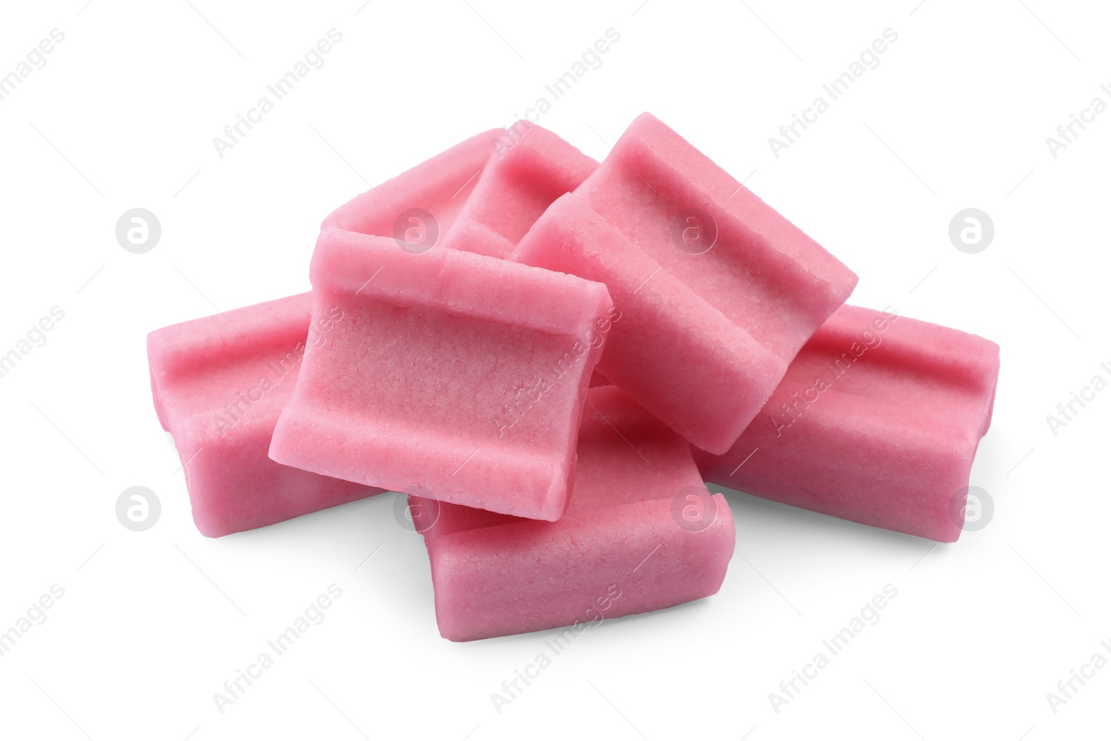 Photo of Pile of tasty pink chewing gums on white background