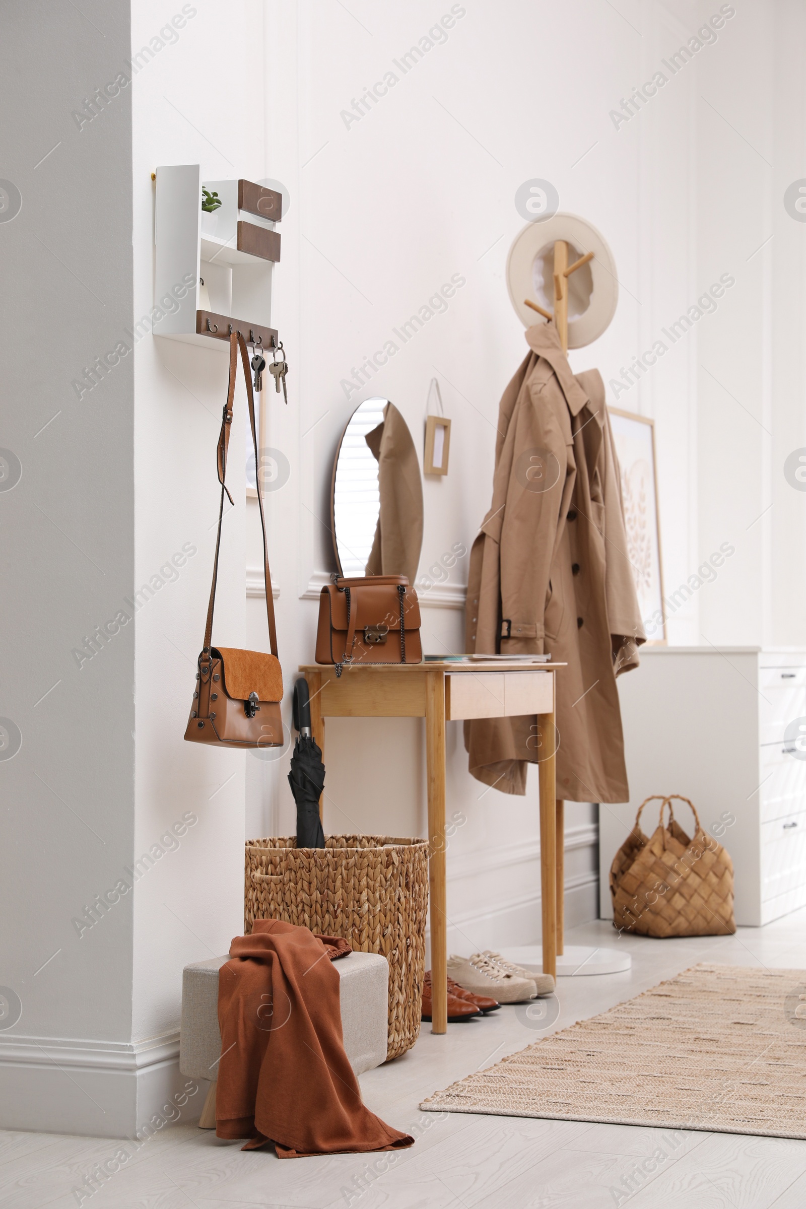 Photo of Modern hallway interior with stylish dressing table and key holder