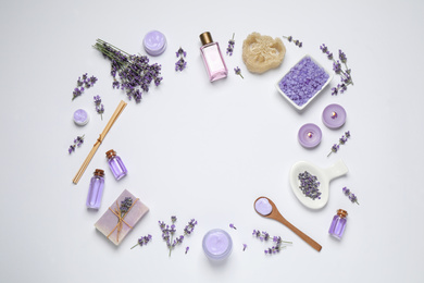 Cosmetic products and lavender flowers on white background, flat lay