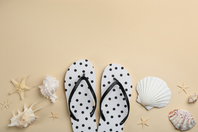 Photo of Flat lay composition with flip flops on beige background. Space for text