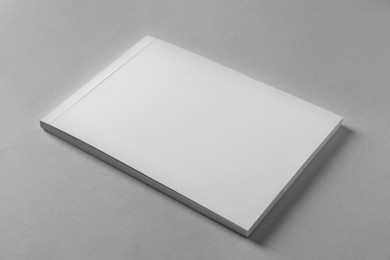 Brochure with blank cover on light grey background