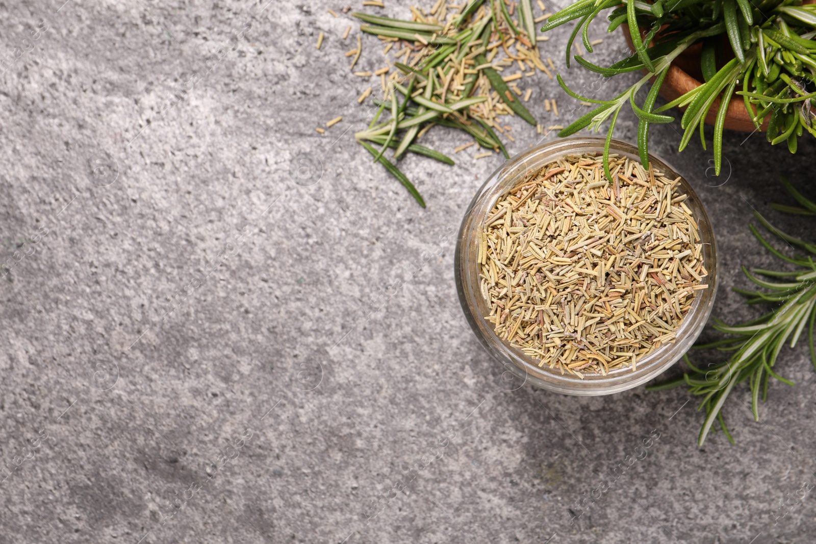 Photo of Dry and fresh rosemary on light grey table, flat lay. Space for text