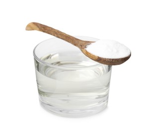 Photo of Vinegar in glass bowl, baking soda and spoon isolated on white