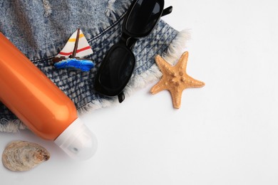 Photo of Flat lay composition with bottle of sunscreen on white background. Space for text