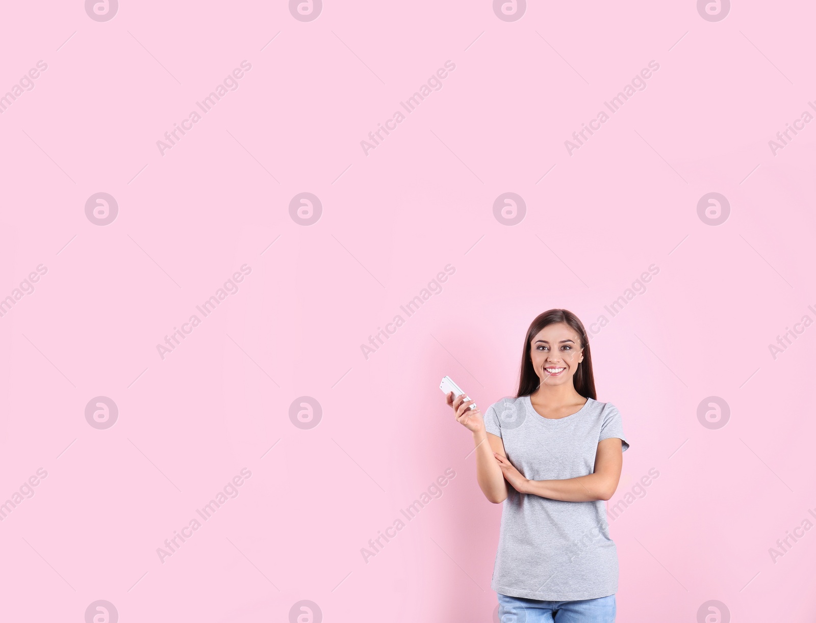 Photo of Young woman with air conditioner remote on color background