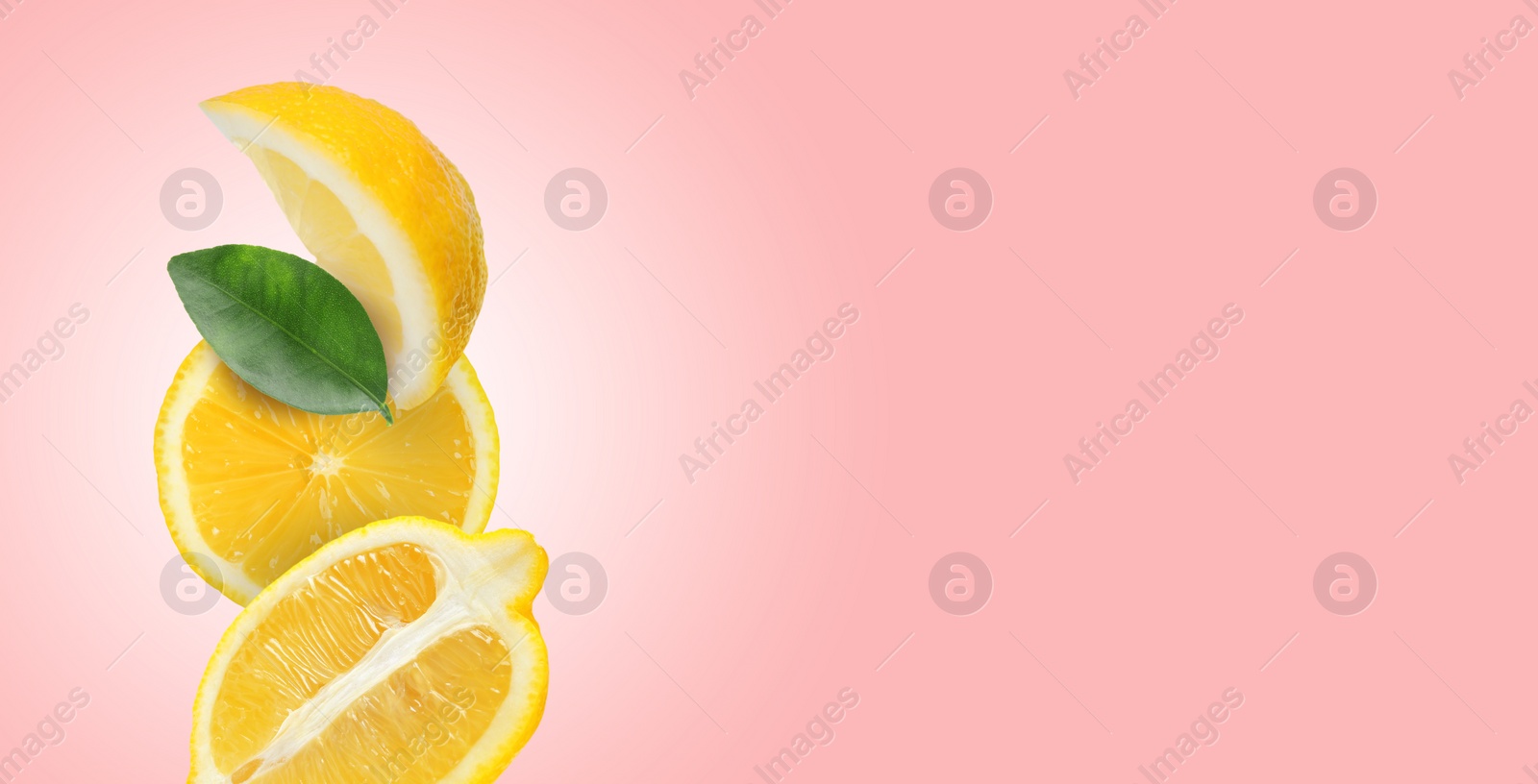 Image of Cut fresh lemons with green leaf on pastel pink background, space for text. Banner design
