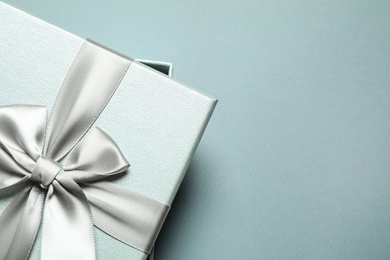 Photo of Beautiful gift box on grey background, top view. Space for text