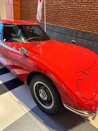 Hague, Netherlands - November 8, 2022: Beautiful view of red retro car in Louwman museum