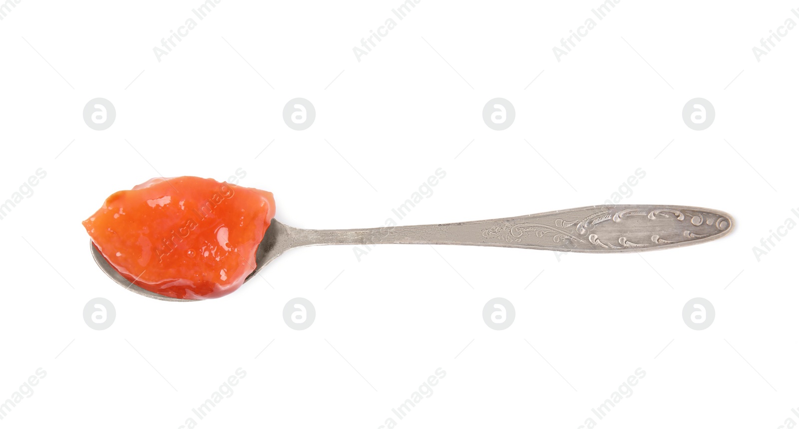 Photo of Spoon with tasty persimmon jam isolated on white, top view