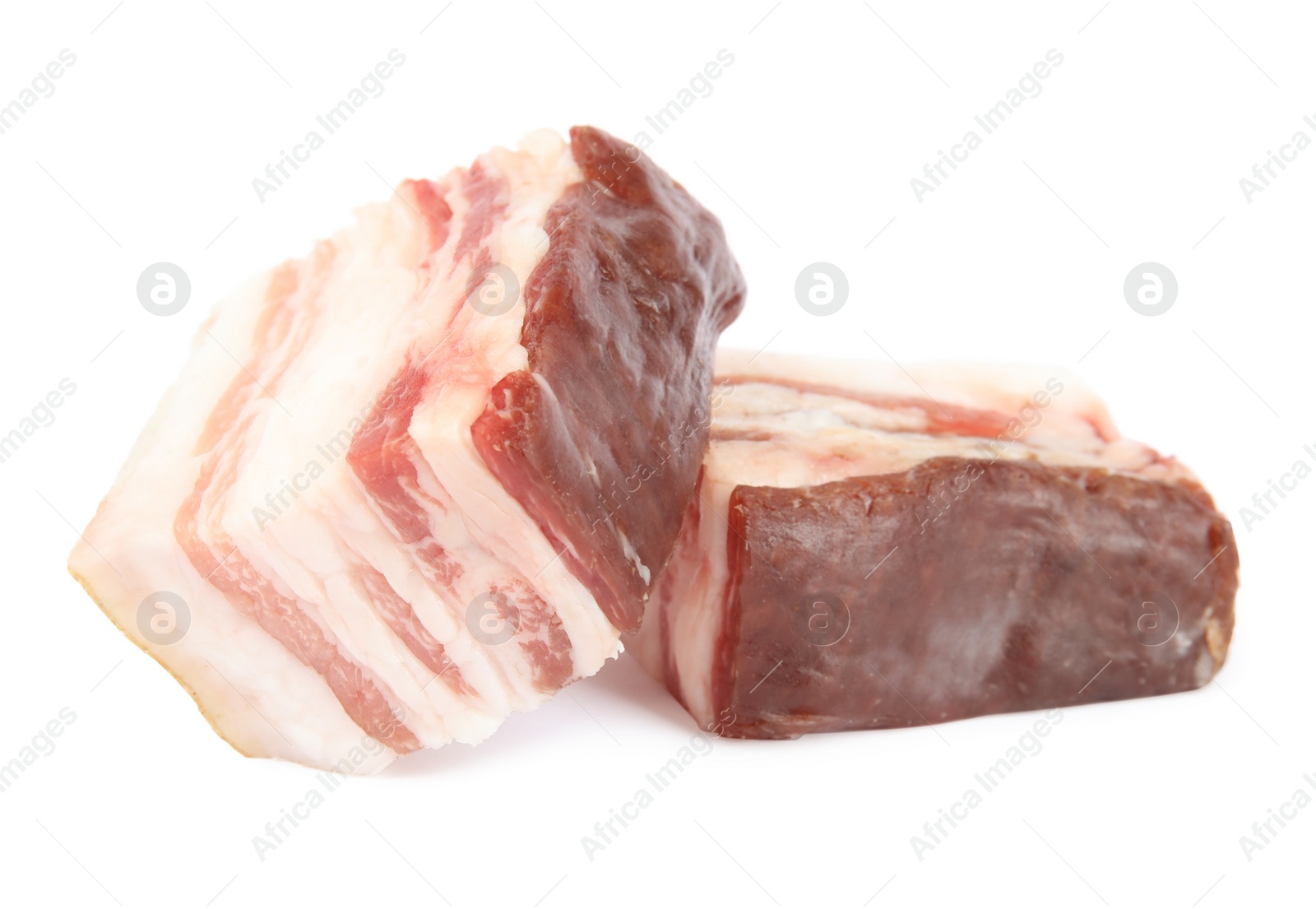 Photo of Pieces of tasty bacon isolated on white