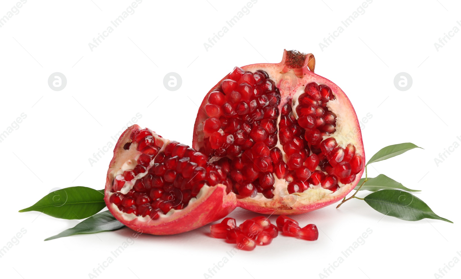 Photo of Ripe pomegranate with leaves on white background