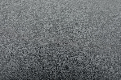 Texture of dark grey leather as background, closeup