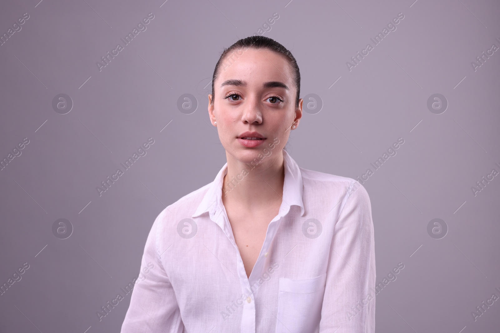 Photo of Portrait of beautiful young woman on light grey background