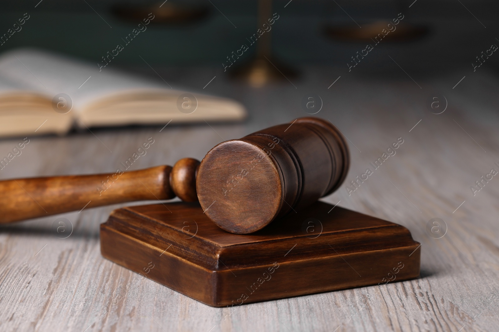 Photo of Law concept. Judge's gavel on light wooden table, closeup