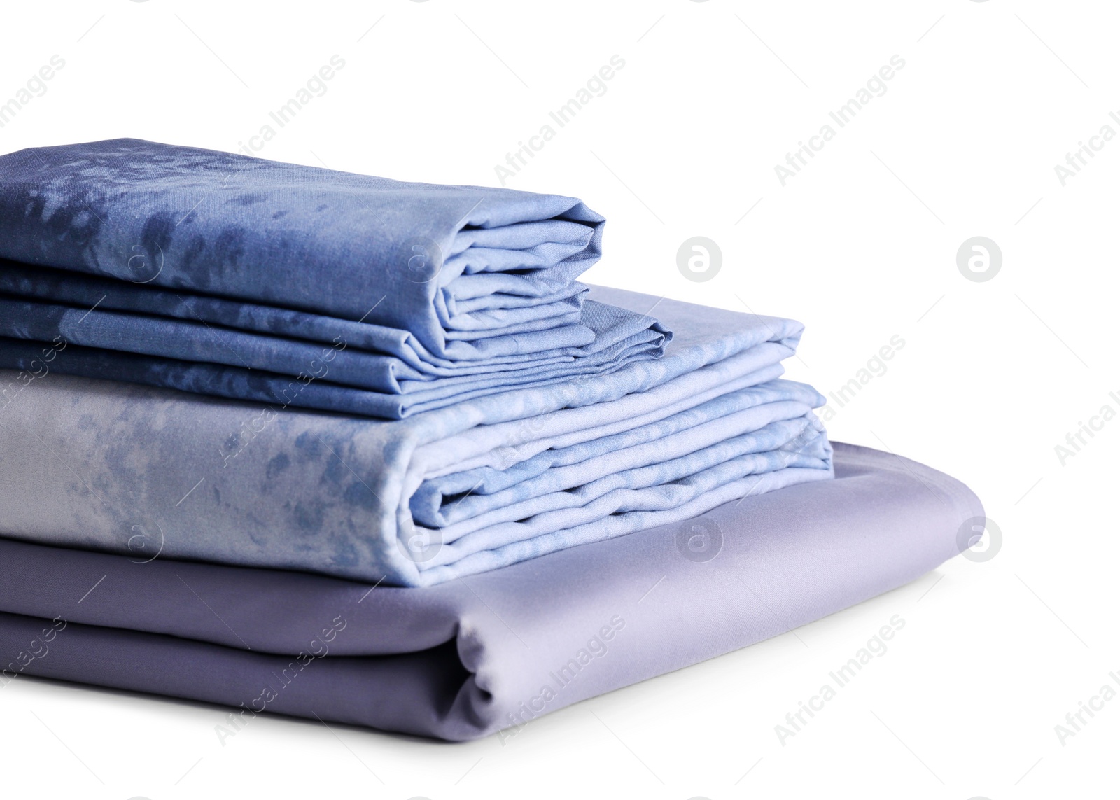 Photo of Stack of clean bed linen isolated on white