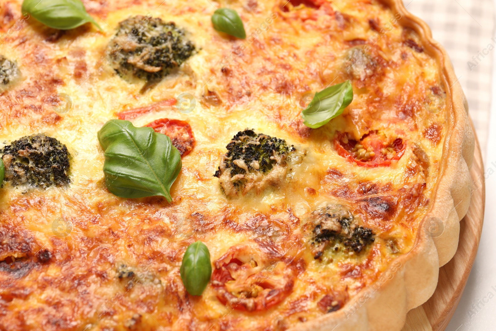 Photo of Delicious homemade vegetable quiche on table, closeup