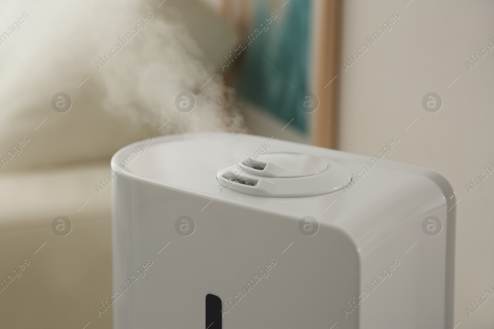 Photo of Modern humidifier on blurred background, closeup view