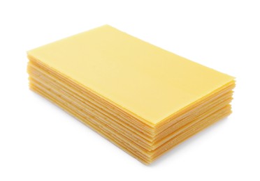 Photo of Stack of uncooked lasagna sheets isolated on white