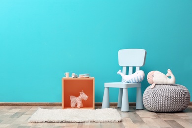 Photo of Stylish children's room interior with toys and new furniture, space for text