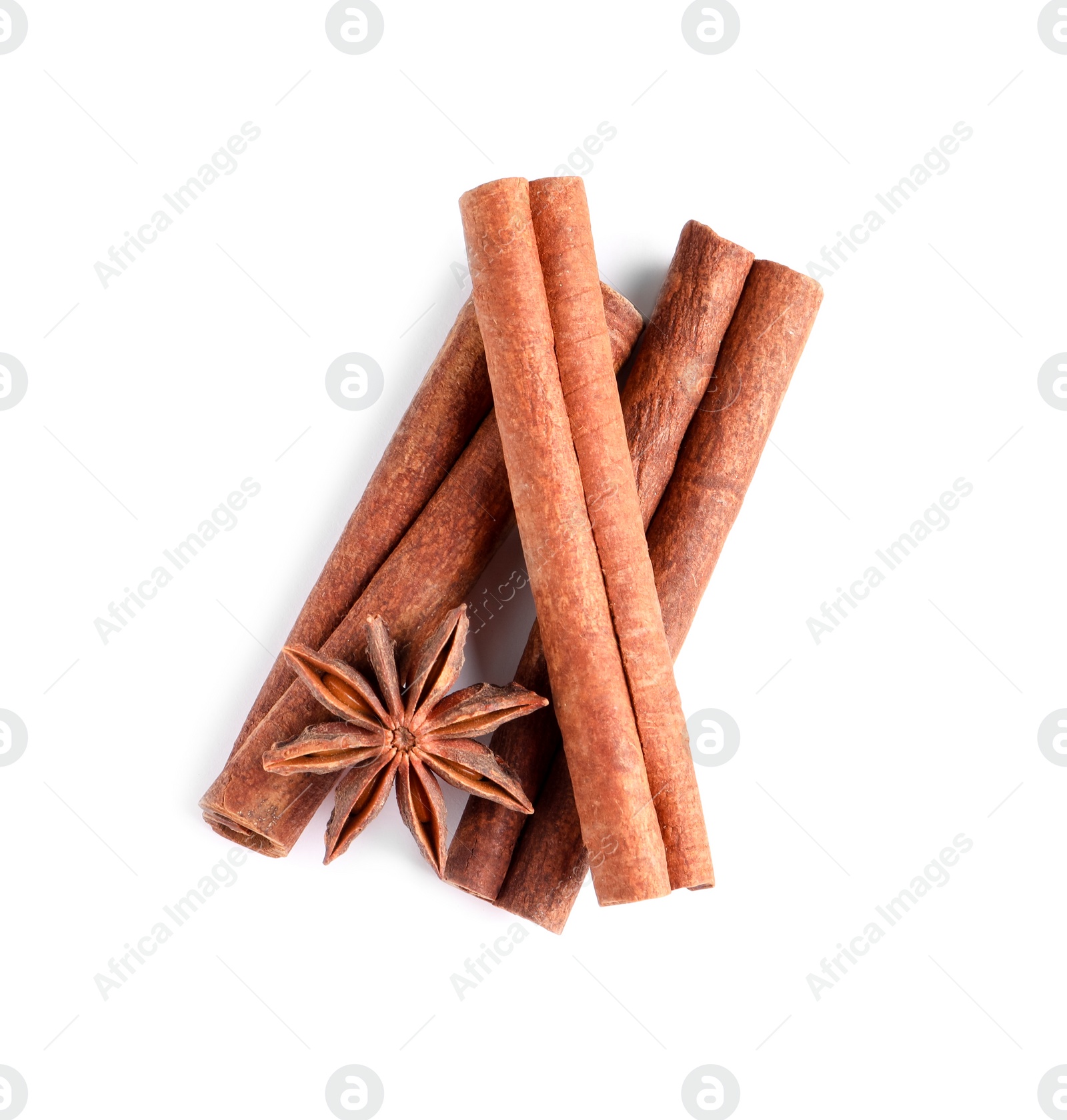 Photo of Cinnamon sticks and anise star isolated on white, top view