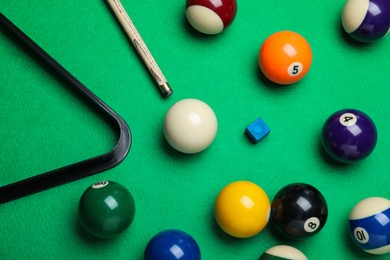 Flat lay composition with balls and cue on billiard table