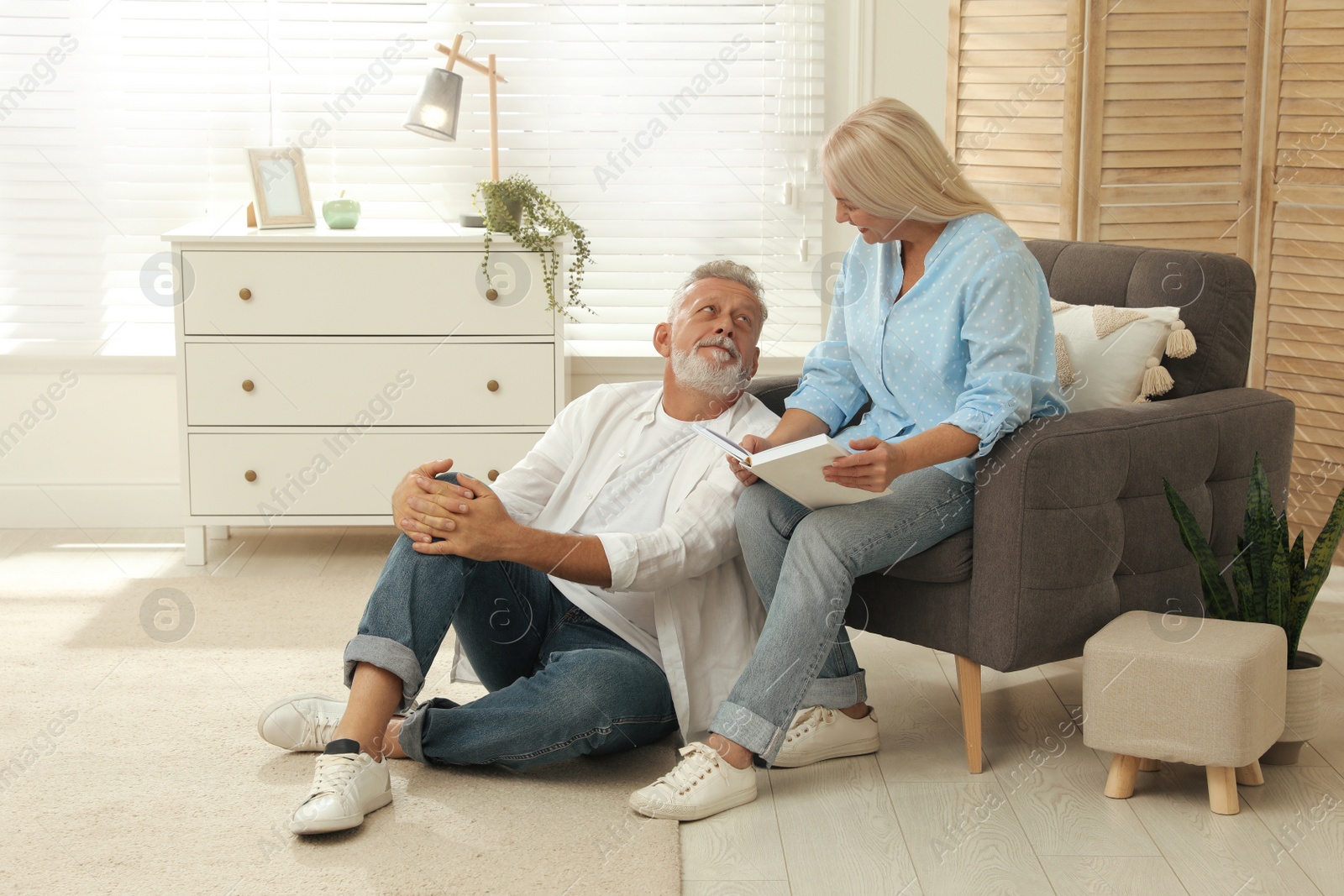 Photo of Happy senior couple spending time together at home