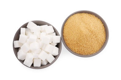 Bowls with granulated and refined sugar on white background, top view