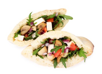 Photo of Delicious pita sandwiches with cheese, mushrooms tomatoes and arugula isolated on white