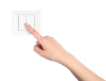 Photo of Woman pressing light switch on white background, closeup