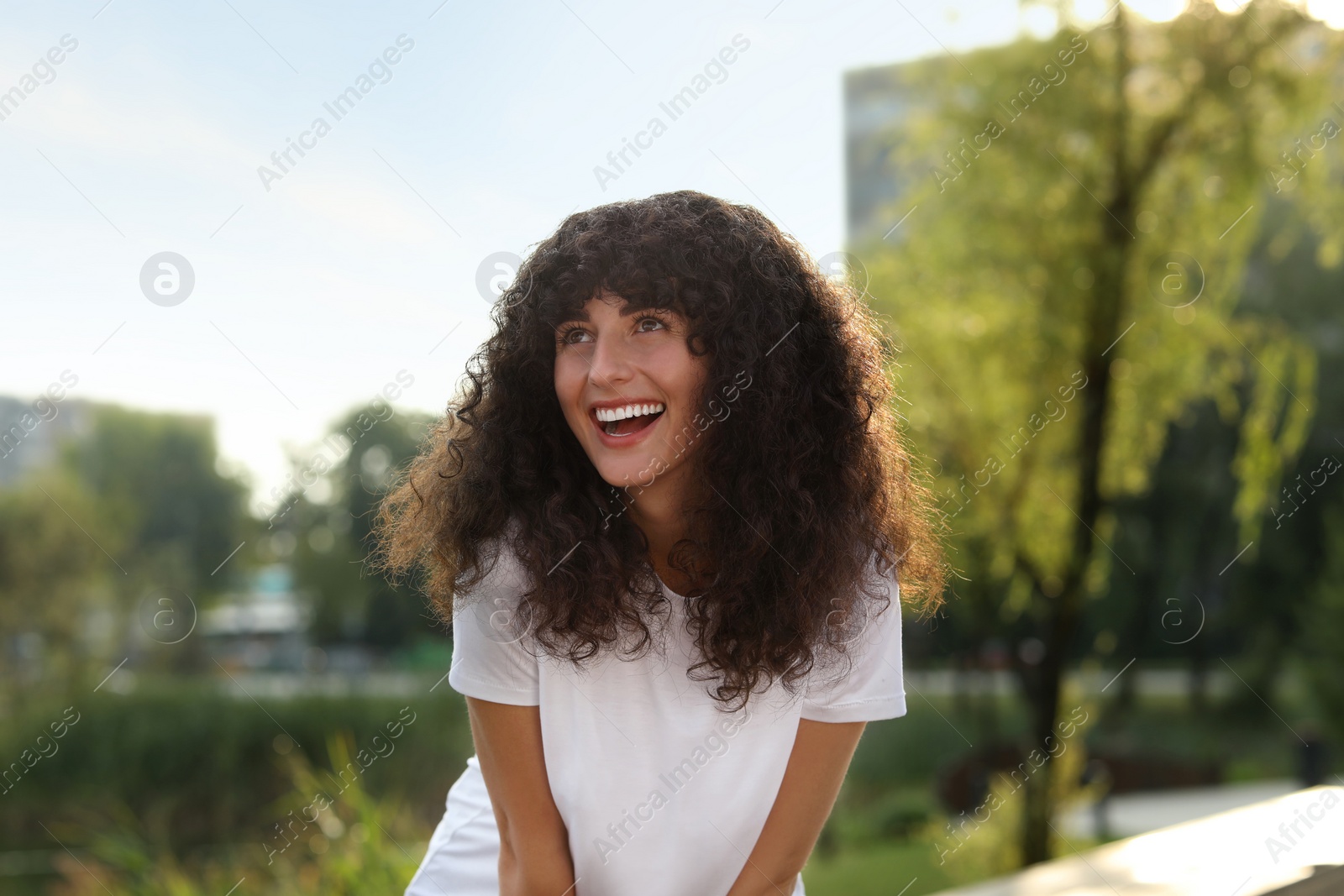 Photo of Portrait of beautiful woman in glasses outdoors. Attractive lady smiling and posing for camera