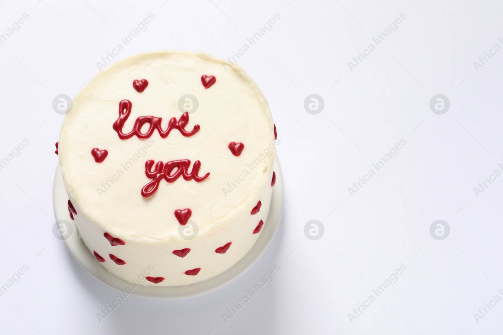 Photo of Bento cake with text Love You on white table, space for text. St. Valentine's day surprise