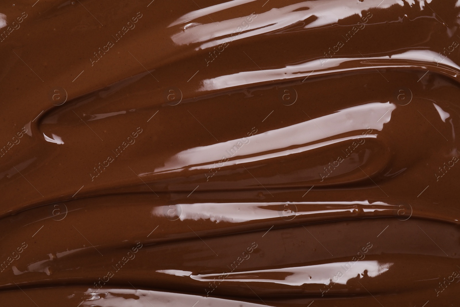 Photo of Tasty chocolate paste as background, closeup view