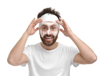 Emotional man with headband washing his face on white background